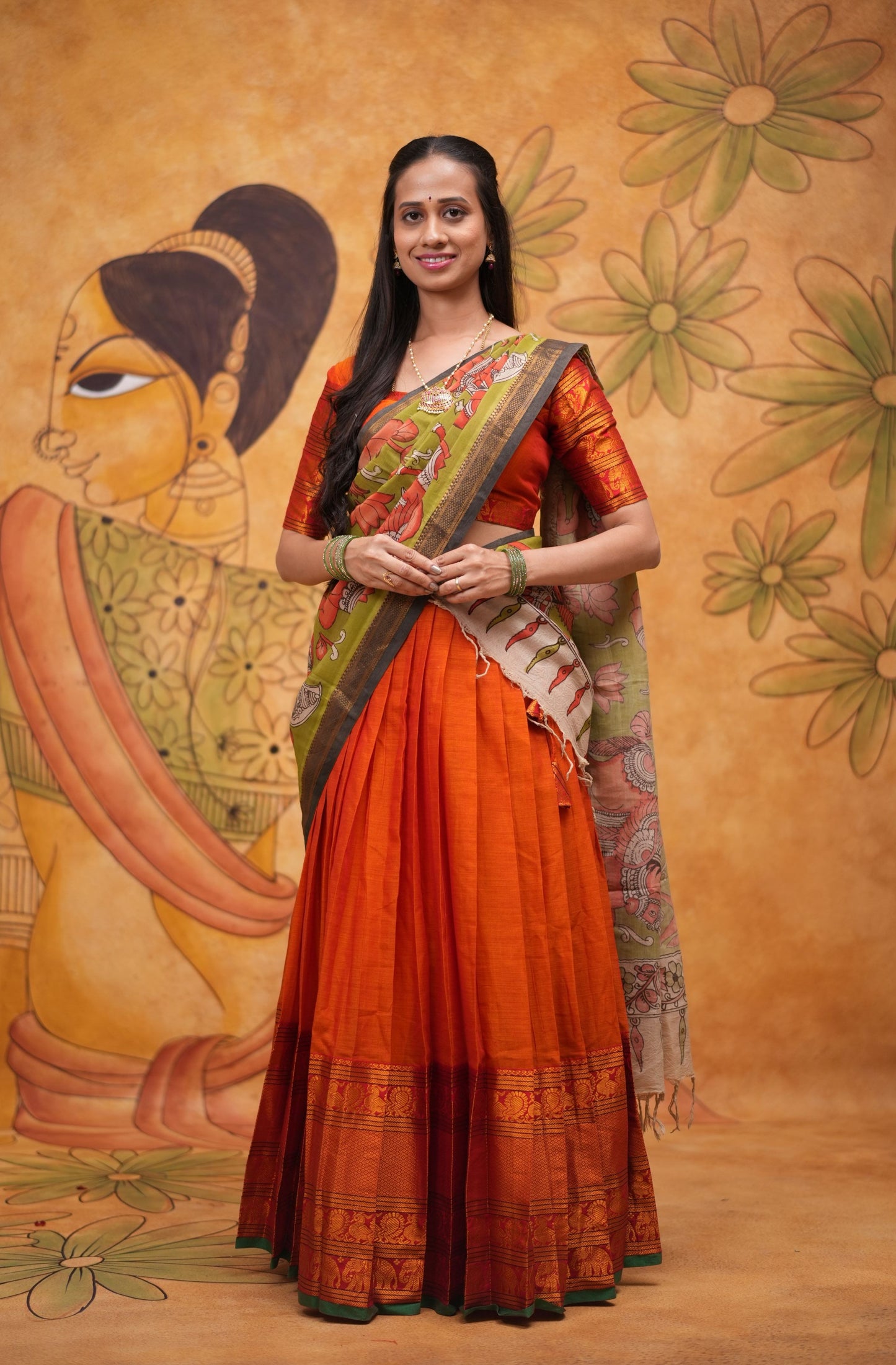 Orange halfsaree with Pen kalamkari duppata