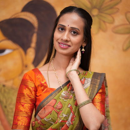 Orange halfsaree with Pen kalamkari duppata